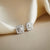 3/4 Carat Cushion Shaped Lab Grown Halo Diamond Stud Earrings in Sterling Silver