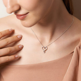 1/8 Carat Heart Shaped Diamond Pendant Necklace with Elongated Ends in Sterling Silver